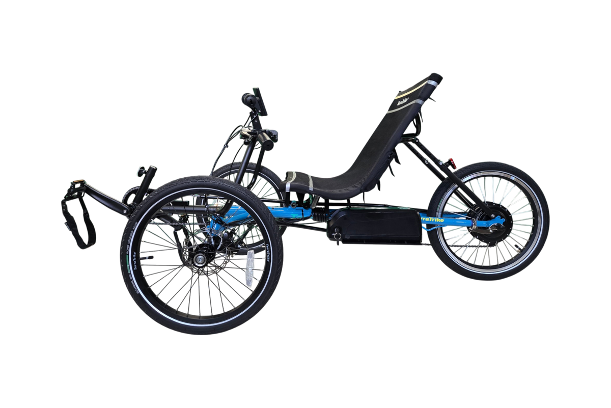 Blue TerraTrike recumbent trike with E-BikeKit electric conversion, left side view showing battery